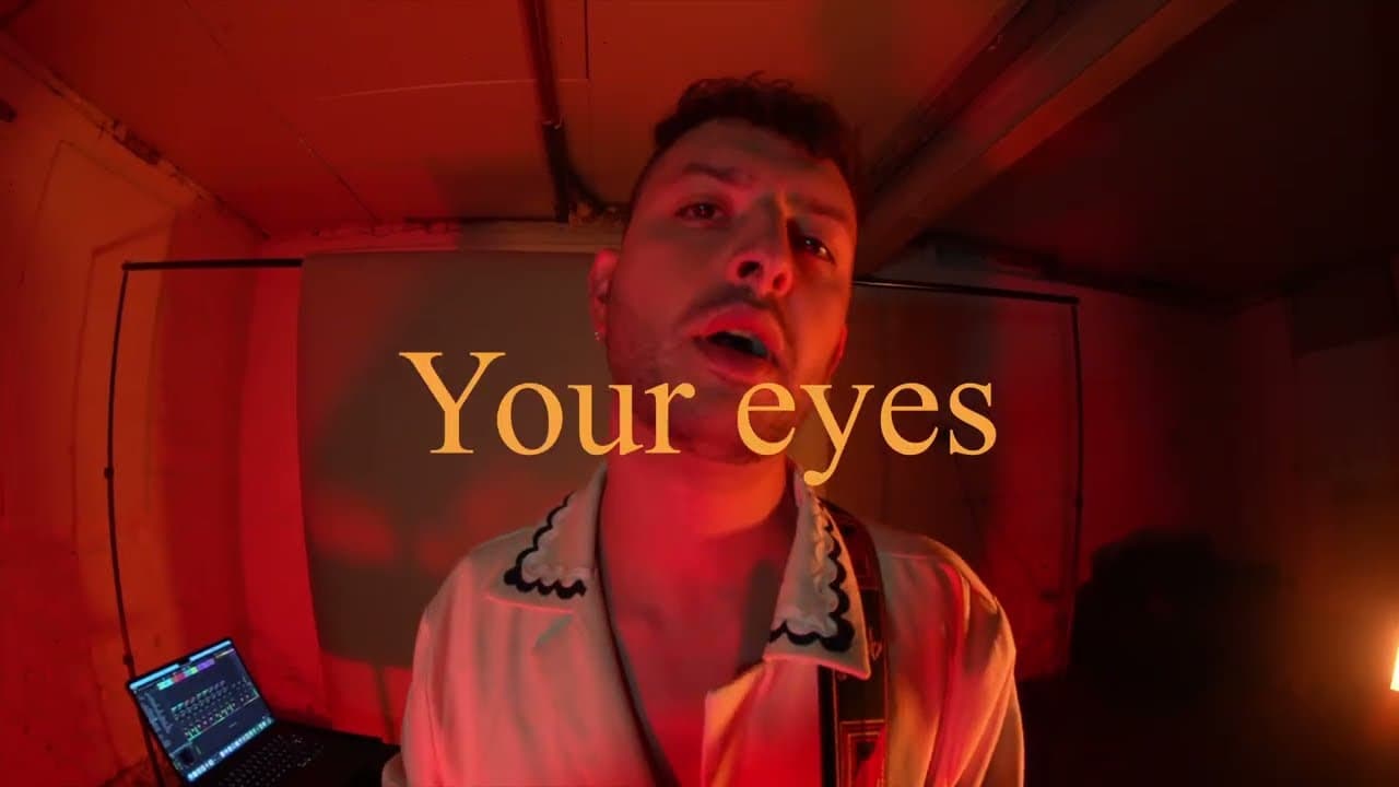 The Sphinx lyric video: Davide performing in warm red light